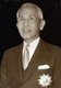 Pibulsongkram was one of the leaders of the military branch of the People's Party that staged a coup d'état and overthrew Thailand's absolute monarchy in 1932. In 1938, Pibulsonggram replaced Phraya Phahol as Prime Minister.<br/><br/>

Pibulsonggram began to increase the pace of modernisation in Thailand. By manipulating the mass media, Pibulsonggram supported fascism and nationalism. In 1939, Pibulsonggram changed the country's name from Siam to Thailand. In 1941, in the midst of World War II, he decreed January 1 the official start of the new year instead of the traditional April 13.<br/><br/>

When the Japanese invaded Thailand on December 8, 1941, Pibulsonggram was reluctantly forced to order a general ceasefire after just one day of resistance. On December 12, Pibulsongkram signed a military alliance with Japan. The following month, on January 25, 1942, Pibulsongkram declared war on the allied powers. At the war's end, Pibulsonggram was put on trial at Allied insistence. However, he was acquitted amidst intense public pressure. Public opinion was favourable to Pibulsonggram as he was thought to have done his best to protect Thai interests.<br/><br/>

Phibun was involved in another coup in 1947, and resumed his pre-war position as effective military dictator until a 1957 coup, led by Sarit Dhanaraj, forced him into exile in Japan where he died in 1964.